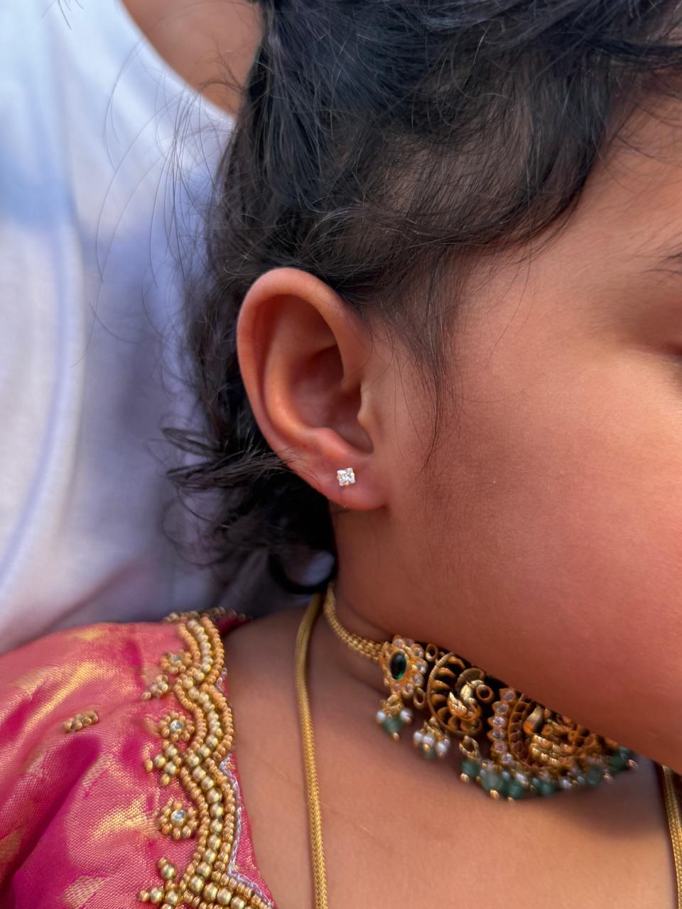 Smiling family—at-home ear piercing experience