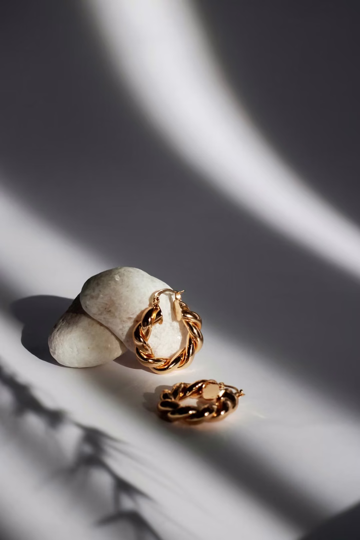 Selection of gold ear piercing studs for professional at-home service